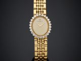 une montre-bracelet en or 18 carats sertie de diamants
