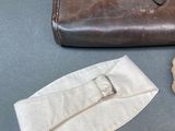 a brown bag and a pair of scissors on a table