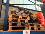 a red fire hydrant sitting on top of a pallet in a warehouse