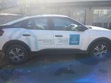 a car that is parked in front of a building