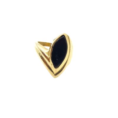 a close up of a gold ring with a black stone