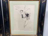two framed drawings of a ballerina in black and gold