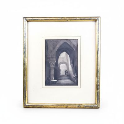an old picture of a man walking down a hallway in a building