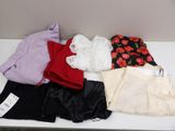 a pile of clothing on a table with a price tag on it