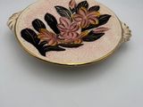 a close up of a plate with flowers on it