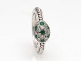 a white gold ring with emerald and diamonds