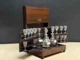 a wooden box with a bunch of wine glasses in it