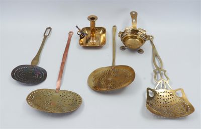 many different types of kitchen utensils on the table