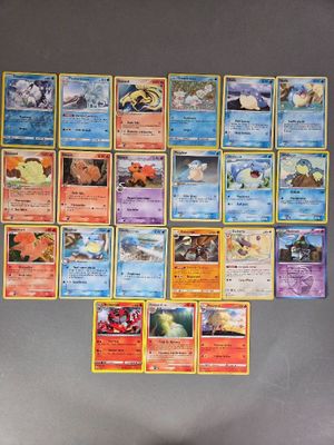 beaucoup de cartes pokemon sur le mur