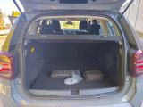 the back of a car with the trunk open and the luggage in the trunk