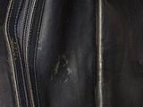 a black purse that is open on the floor