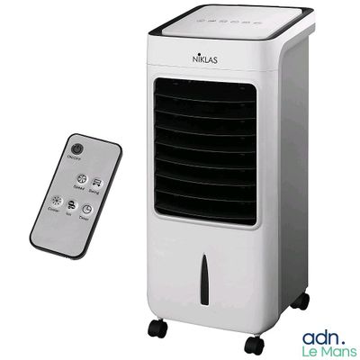 a white air conditioner sitting next to a remote control