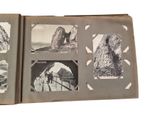 an old book with pictures of mountains and people on it
