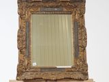 a wooden easel with a mirror on top of it