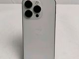 the back of a white iphone 11 with three camera lenses on it