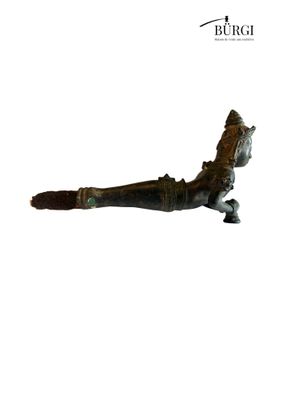 an image of a figurine of a bird on a branch