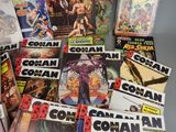 a lot of comic books that are on the table