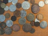 a lot of coins that are on the table