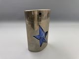 a close up of a silver lighter with a blue star on it