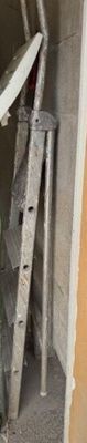 a surfboard leaning up against a wall in a garage