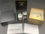 a box that has a cell phone and a pen in it