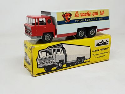 two toy trucks that are sitting on top of each other