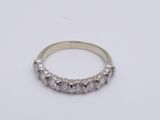 an 18k white gold ring with five round brilliant cut diamonds