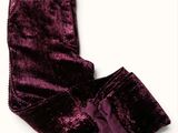 purple velvet pants with buttons and a bow on the side
