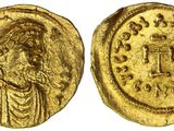 une pièce d'or portant l'image d'un homme
