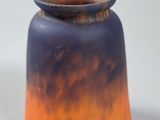 a small vase with a blue and orange design on it