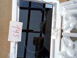 a white refrigerator with a glass door that has ice cubes inside of it