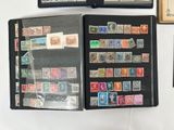 a lot of stamps on the pages of a book