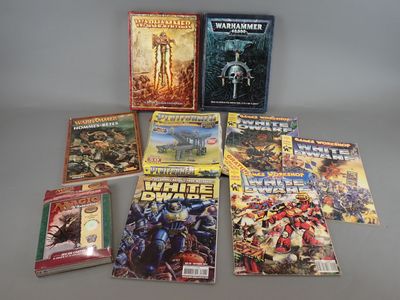 several comic books are arranged on a table with a gray background