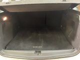 a trunk of a car with the back door open