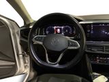 the interior of a car with a steering wheel and dashboard controls
