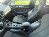 the interior of a car with black leather seats and a steering wheel