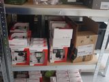 many boxes of electronics on the shelves in the store