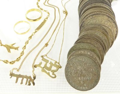 a lot of gold and silver jewelry on a white table