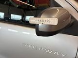 a sticker on the side mirror of a car