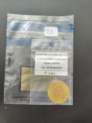 a small coin in a plastic bag on a table