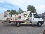 a white truck with a crane on the back of it