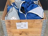 a wooden box filled with blue and gray clothing