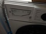 a washer and a dryer sitting next to each other