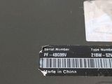 a label on the back of a laptop that says serial number