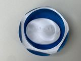 a blue and white plate with a picture of a city on it