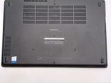 a black laptop with a blue sticker on it