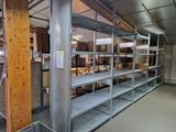 many shelves that are in the middle of a room