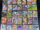 a large collection of pokemon cards are displayed on a table