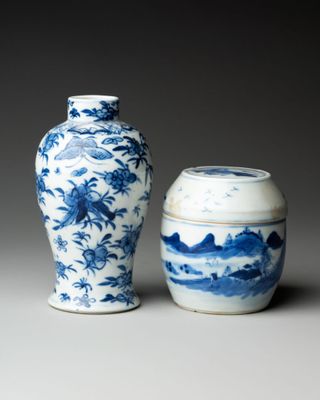 pair of chinese blue and white vases with landscape design