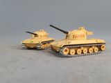 two toy tanks sitting side by side on a table